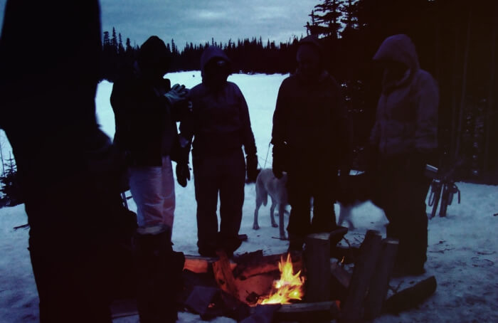 people gathered around a fire