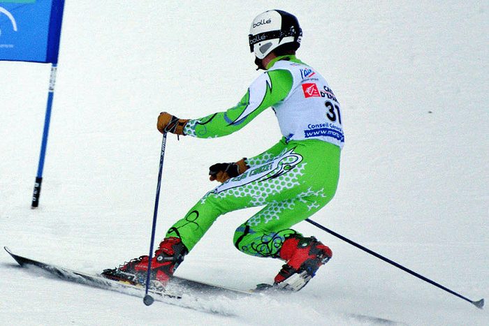 alpine skier skiing on snow