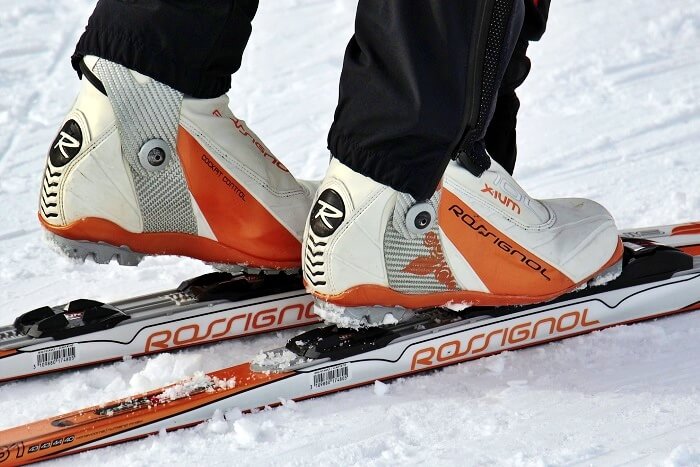 closeup on rossignol skiing boots and skis
