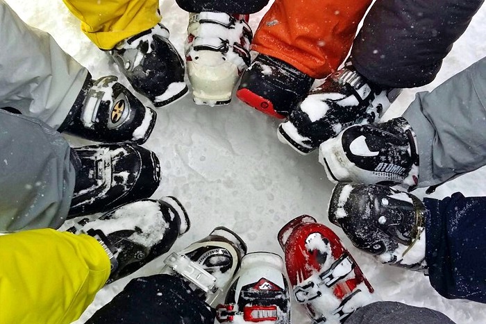closeup on a circle of ski boots
