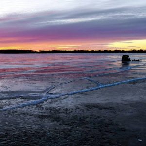 frozen lake at sunset 