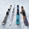 four different skis on snow