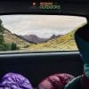 best sleeping bags in car looking at mountain scenery